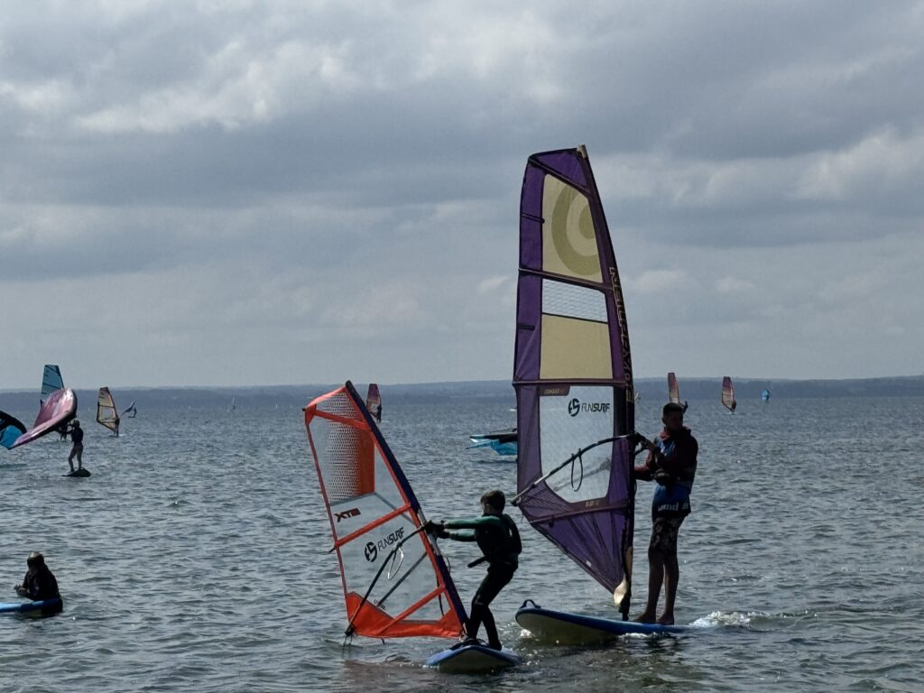 Surfers in Chałupy, Poland. (July 2025)
